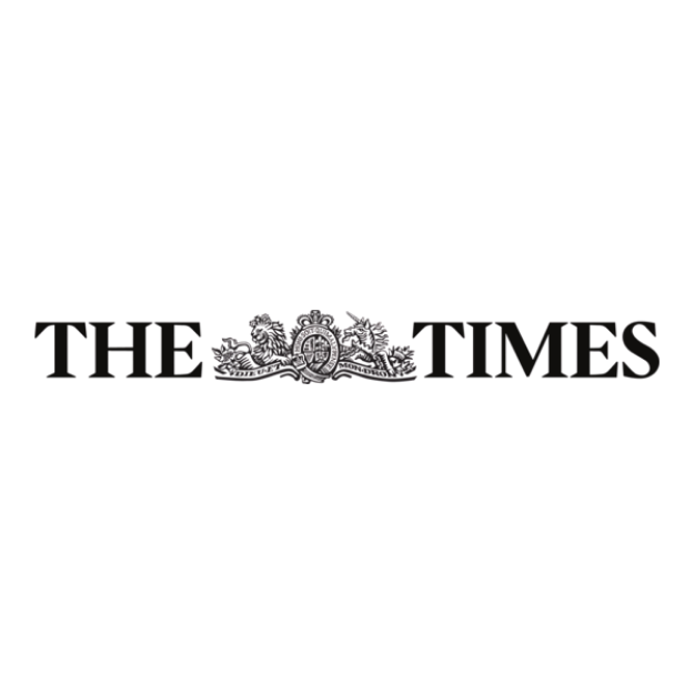 A black and white logo with a decorative emblem in the center, featuring the missing words in the phrase 'The Times'.